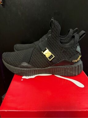 Puma Black Slip-On Knit Sneakers with Gold Hardware